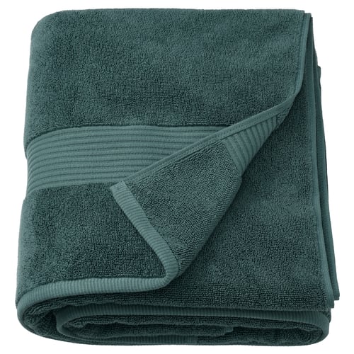 Serviette FREDRIKSJÖN pliée vert foncé avec bordure tissée, 100 % coton.