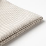 Pli en tissu texturé aux tons neutres illustré, faisant probablement partie d’une housse de coussin d’extérieur durable.