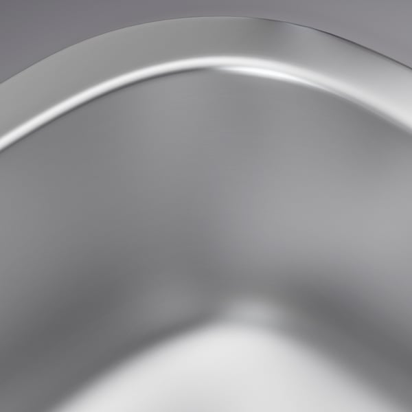 Évier en acier inoxydable, lisse, réfléchissant la lumière, mettant en valeur des matériaux de haute qualité.