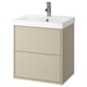 Un meuble de salle de bain HAVBÄCK beige avec un lavabo en céramique blanche. Il dispose de deux tiroirs spacieux et d’un design épuré et minimaliste.