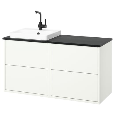 Meuble de salle de bain moderne blanc avec dessus en marbre noir.