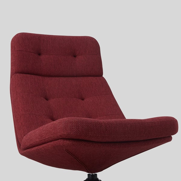 Chaise de bureau rembourrée rouge avec coussins de dossier et d’assise, design capitonné, vue latérale.
