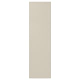 Une porte d’armoire HAVSTORP beige au design lisse et moderne faite de peinture acrylique et de panneaux de fibres.