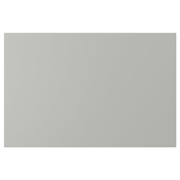 Une façade rectangulaire gris clair d’armoire de cuisine HAVSTORP. La surface lisse et laquée assure un nettoyage facile et un look moderne.