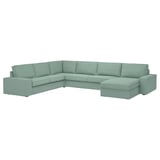 Canapé sectionnel KIVIK vert clair avec accoudoirs bas et coussins profonds, conçu pour le confort et la détente.