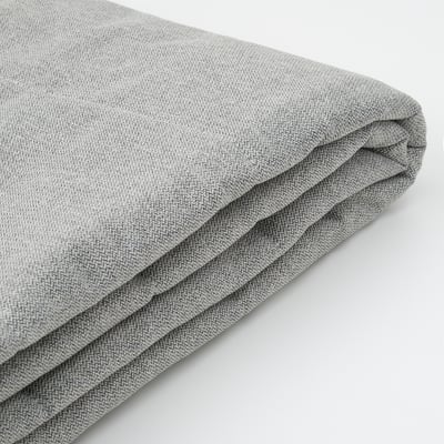 Gros plan d’un tissu gris doux et plié, mettant en valeur une texture et une qualité supérieures.