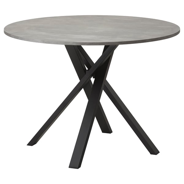 Table de salle à manger ronde moderne avec plateau en béton gris et pieds entrecroisés en métal noir.