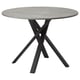 Option : Table de salle à manger ronde moderne avec plateau en béton gris et pieds entrecroisés en métal noir.