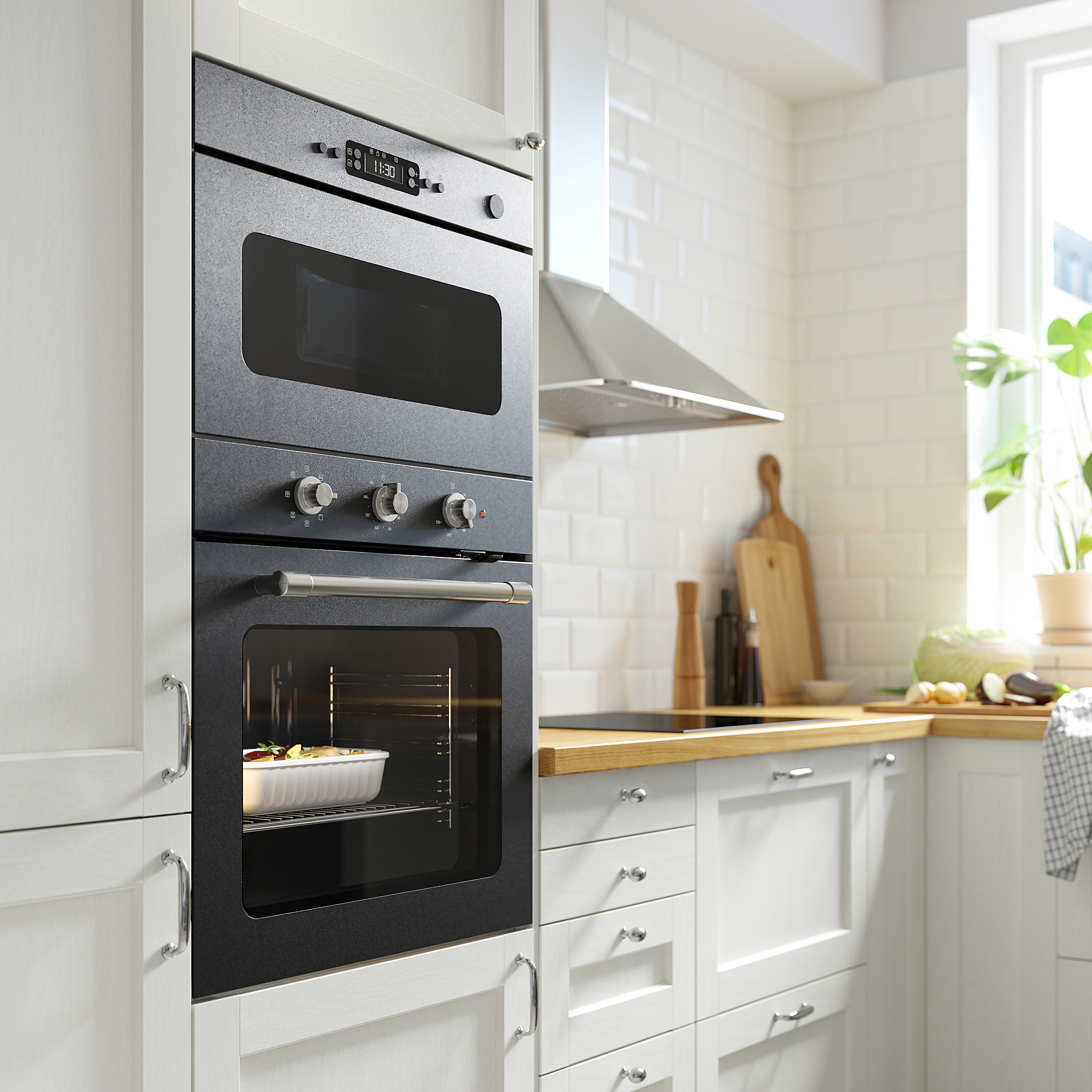 Cuisine moderne avec four encastré noir avec affichage numérique et boutons, encastrés dans des armoires blanches. Plat à l’intérieur, articles de comptoir à proximité.