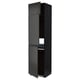 Armoire de cuisine noire moderne avec portes ouvertes, design élégant, poignées métalliques, robustes et hautes.