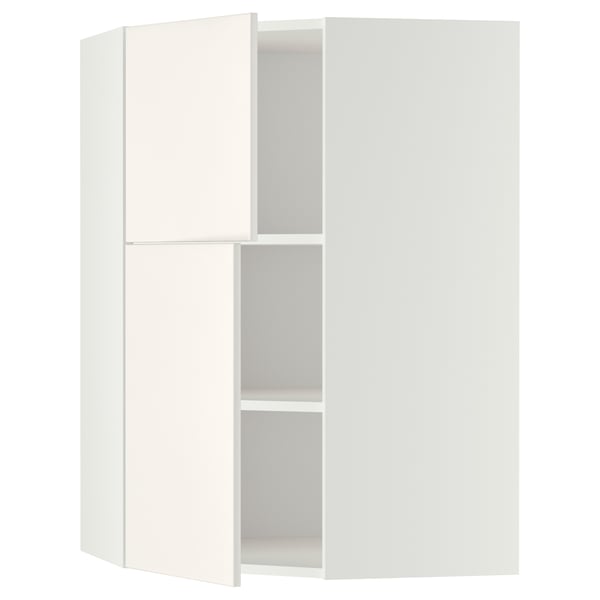 Un meuble de cuisine d’angle METOD blanc avec étagères réglables et porte réversible.
