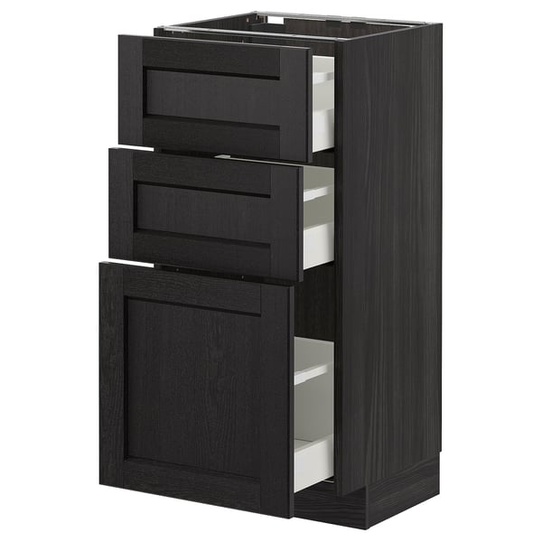 Une armoire en bois teinté noir avec trois tiroirs et une porte, faisant partie du système de cuisine METOD.