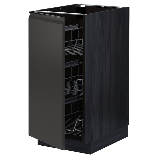 Armoire de cuisine METOD noire avec paniers en fil métallique coulissants, finition grain de bois foncé, forme rectangulaire, design minimaliste.
