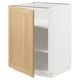 Armoire de cuisine METOD, blanche avec porte en chêne, forme carrée et bords biseautés.