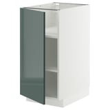 Armoire de cuisine METOD en gris-vert brillant avec cadre blanc et étagère réglable.