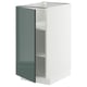 Armoire de cuisine METOD en gris-vert brillant avec cadre blanc et étagère réglable.