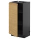 Une armoire de cuisine moderne nommée METOD avec une porte en bois brun clair et une base gris foncé. Il a un design minimaliste avec des poignées intégrées.