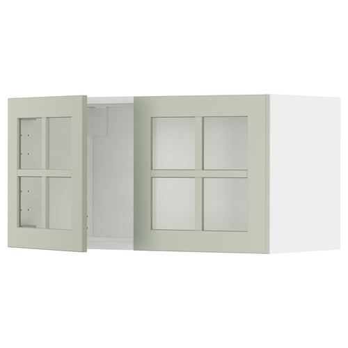Un meuble de cuisine METOD vert avec des portes vitrées doubles, au design moderne et artisanal.