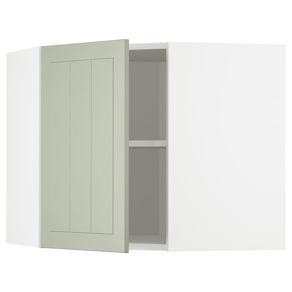 Armoire de cuisine d’angle METOD vert clair ouverte, révélant des étagères.