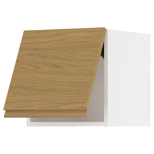 Une armoire de cuisine METOD aux tons bois au design épuré et minimaliste. Il a des lignes épurées et une finition chêne.