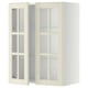 Armoire de cuisine METOD blanche avec portes en verre dépoli et étagères réglables.
