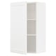 Armoire murale METOD blanche ouverte avec une étagère, design minimaliste.