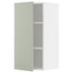 Armoire ouverte vert clair METOD avec étagères réglables.