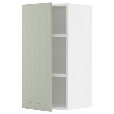 Armoire ouverte vert clair METOD avec étagères réglables.