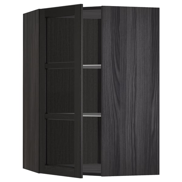 Armoire d’angle en bois teinté noir avec portes en verre.