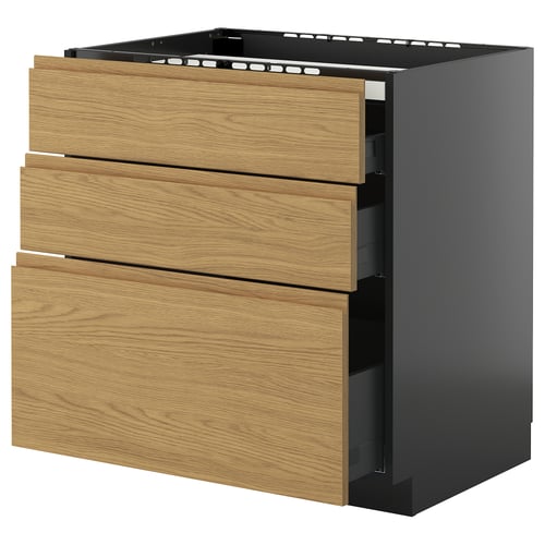Unité de cuisine moderne, nommée METOD, avec tiroirs en chêne clair voxtorp et base gris foncé. Trois tiroirs, design élégant et minimaliste.
