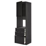 Unité de cuisine METOD noire avec finition en bois foncé, armoire ouverte, trois tiroirs, design élégant.