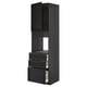 Unité de cuisine METOD noire avec finition en bois foncé, armoire ouverte, trois tiroirs, design élégant.