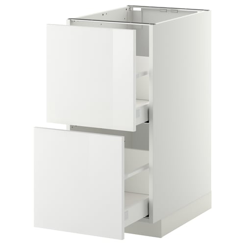 Armoire de cuisine blanche brillante avec tiroirs ouverts, design moderne et élégant.