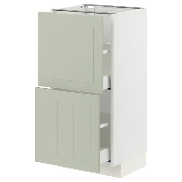 Meuble de cuisine METOD manquant, vert clair, rectangulaire avec des panneaux plats, partiellement ouvert laissant apparaître des étagères, design élégant et moderne.