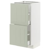 Meuble de cuisine METOD manquant, vert clair, rectangulaire avec des panneaux plats, partiellement ouvert laissant apparaître des étagères, design élégant et moderne.