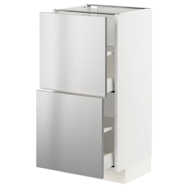 Un meuble de cuisine METOD blanc avec des portes en acier inoxydable. Il a deux sections et plusieurs tiroirs, doté d’un design industriel moderne.