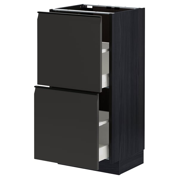 Armoire de cuisine METOD noire avec tiroirs ouverts, design moderne.