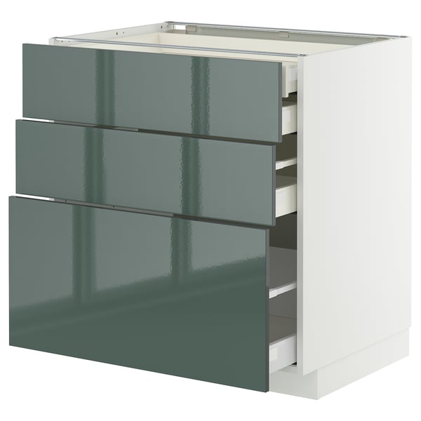 Armoire de cuisine moderne verdure brillante avec trois tiroirs coulissants.