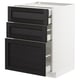 Meuble à tiroirs en frêne teinté noir METOD avec bords biseautés dans un meuble blanc moderne.