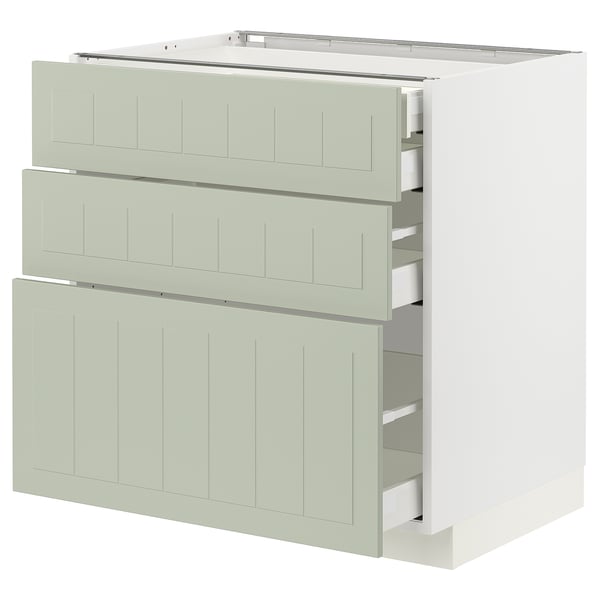 Une armoire de cuisine METOD vert clair avec trois façades de tiroirs lisses et un design élégant et artisanal.