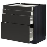 Armoire de cuisine ikea METOD noire avec quatre tiroirs ouverts, design moderne.