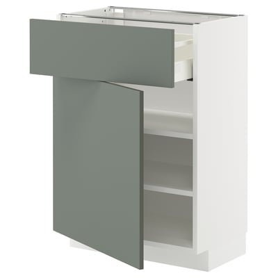 Unité de cuisine moderne avec tiroir verdâtre, armoire blanche, étagères réglables, design épuré.