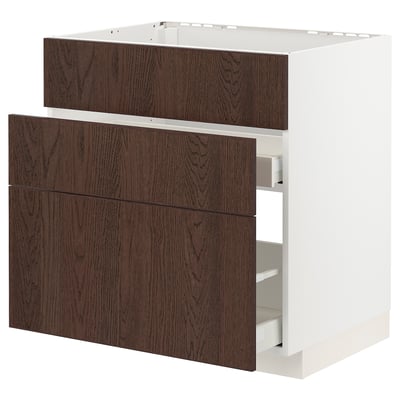 Unité de cuisine Ikea METOD, base blanche, tiroirs en bois brun foncé, trois grands tiroirs, forme carrée.