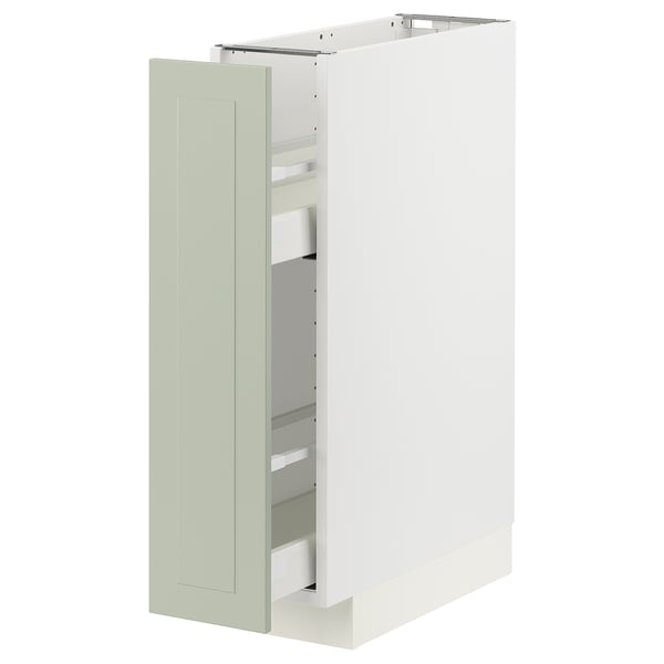 Un meuble de cuisine METOD blanc ouvert avec des portes en stensund vert et des étagères coulissantes.