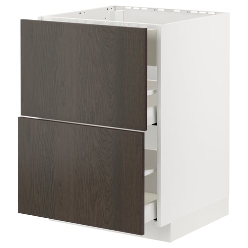 Façades de tiroirs brun foncé avec bords en bois massif sur armoire blanche.