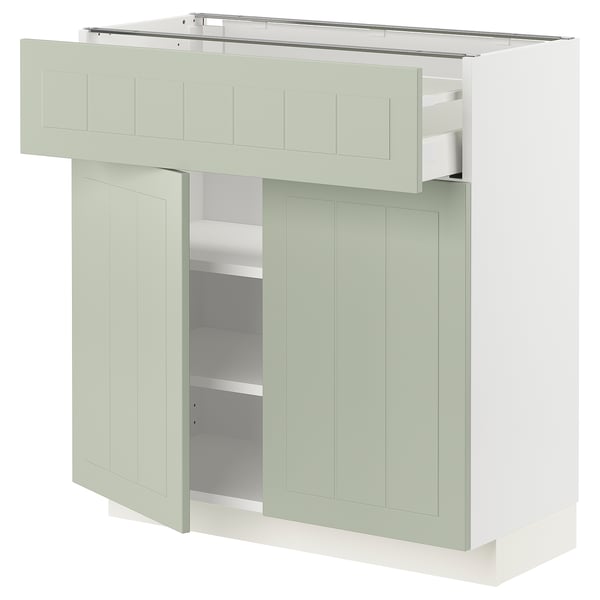 Armoire de cuisine moderne, vert pâle, rectangulaire, avec un tiroir et deux portes. Fabriqué à partir de panneaux de fibres et de particules.