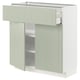 Armoire de cuisine moderne, vert pâle, rectangulaire, avec un tiroir et deux portes. Fabriqué à partir de panneaux de fibres et de particules.