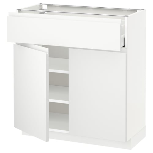Une armoire de cuisine METOD blanche avec un tiroir et une étagère ouverte, qui fait partie de la série moderne et minimaliste voxtorp d’ikeas.