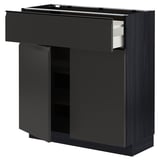 Armoire de cuisine noire avec tiroir et étagère, design moderne.