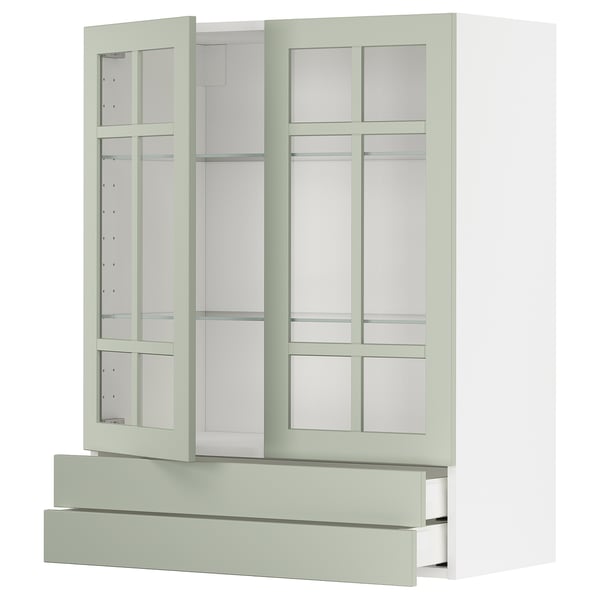 Set de cuisine METOD : portes en verre vert clair, armoires blanches, design moderne.